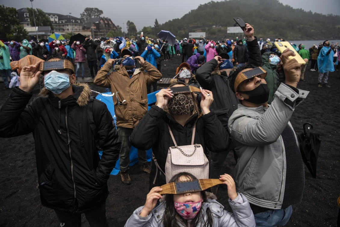 The total solar eclipse as seen from from Pucon, southern Chile, on December 14, 2020. The hopes of thousands of tourists and residents in Chile's south saw their hopes of watching a total eclipse of the sun shrink as heavy rain fell on Monday just hours before the expected event.Martin BERNETTI / AFP
