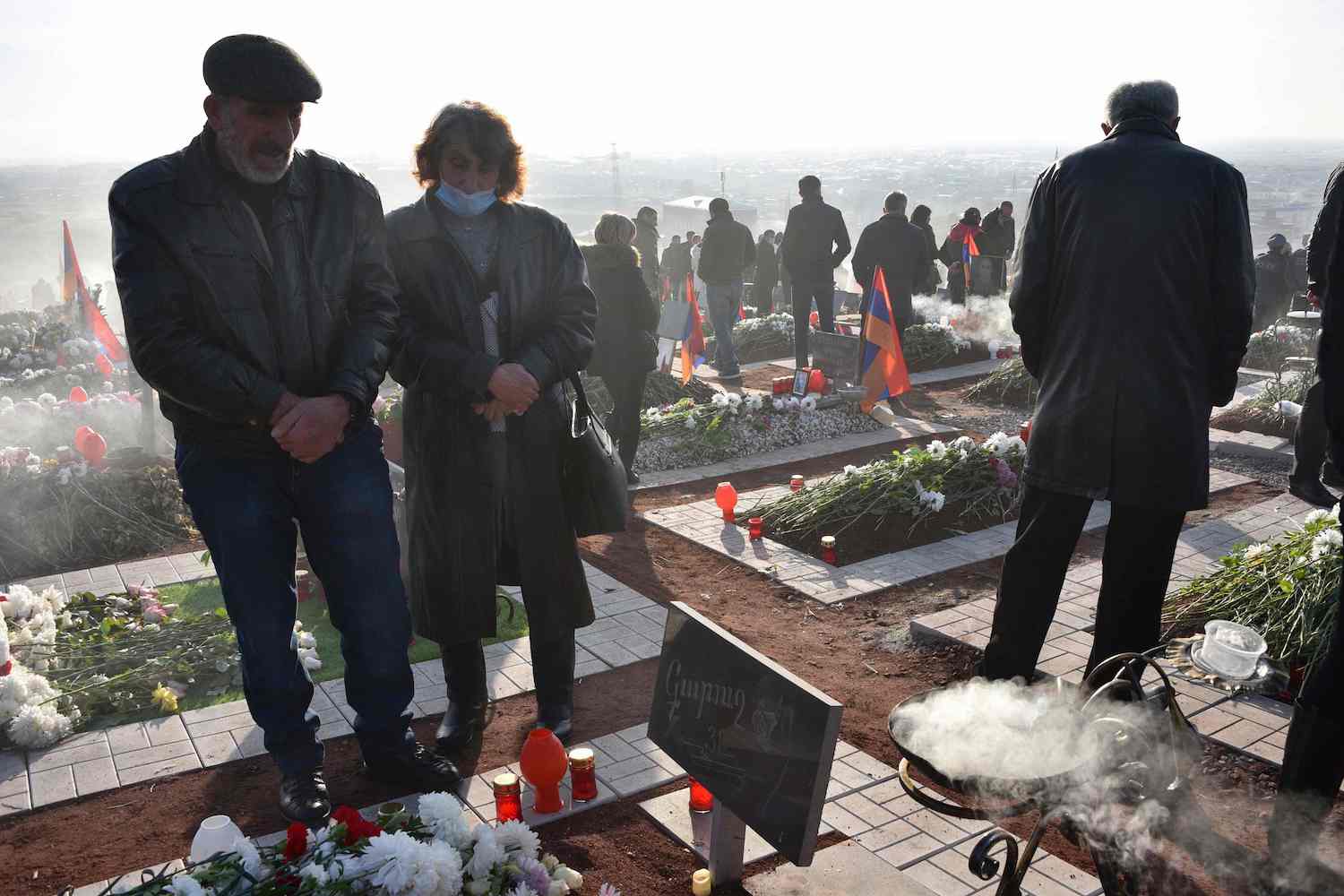 Relatives of the victims of the war over Karabakh, gather for a memorial ceremony, at the Yerablur Military Memorial Cemetery in Yerevan, on December 19, 2020. (AFP)