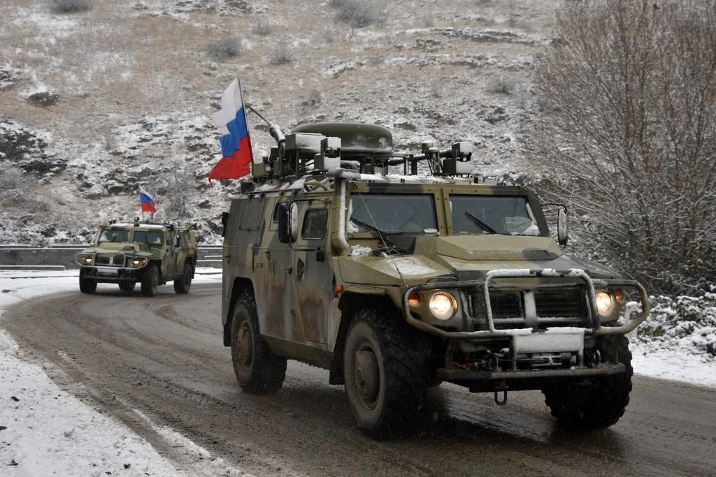 Military vehicles of the Russian peacekeeping force move on the road outside Lachin on November 29, 2020, after six weeks of fighting between Armenia and Azerbaijan over the disputed Nagorno-Karabakh region. (File/AFP)
