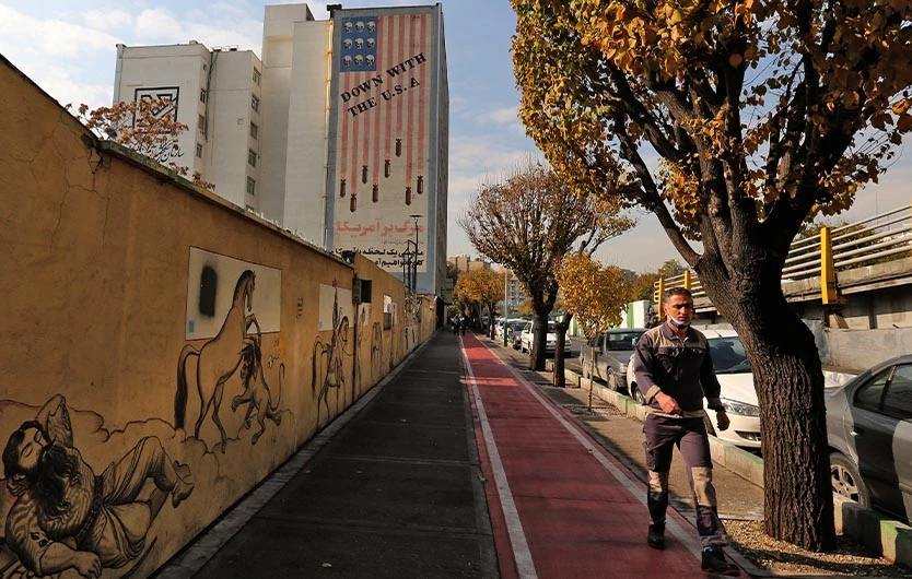 A large anti-US mural covers the wall of a building in the centre of Iran's capital Tehran, on November 30, 2020. (AFP)