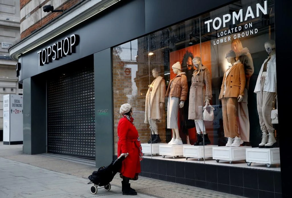 Above, a shuttered Topman clothes store, operated by Arcadia, in central London on Nov. 30, 2020. (AFP)