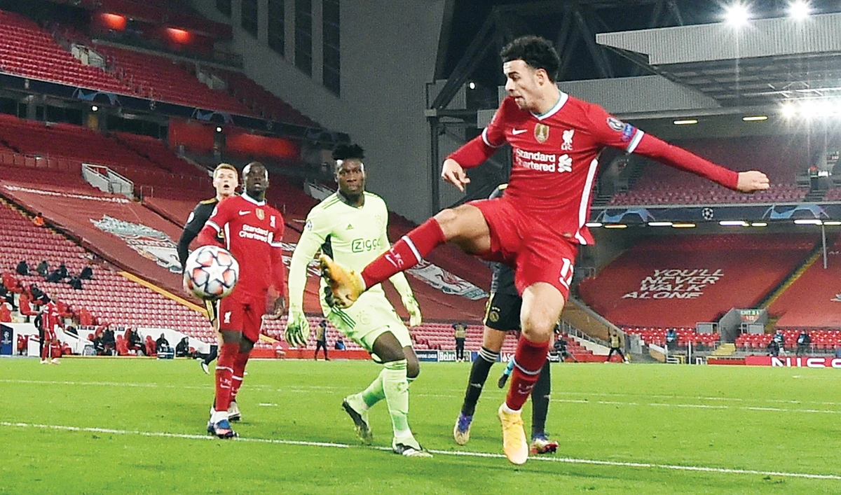 Liverpool’s Curtis Jones scores their solitary goal as Ajax’s Andre Onana looks in their Champions League Group D match. (Reuters)