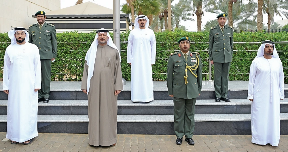 The UAE Embassy staff stands for a minute of silent prayer in honor of of those who lost their lives in defense of the homeland. (AN photo by Basheer Saleh)