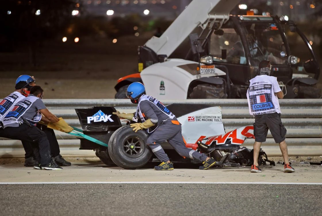 Stewards recover Haas F1’s French driver Romain Grosjean’s car during the Bahrain Formula One Grand Prix at the Bahrain International Circuit on Nov. 29, 2020. (AFP)