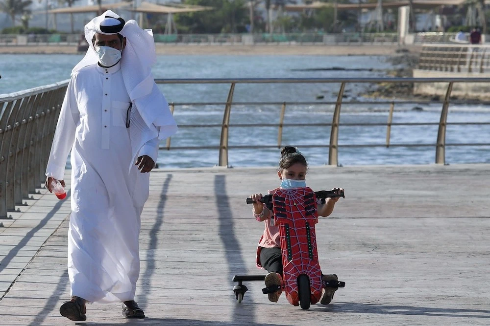 A Saudi man and his daughter stroll down the seafront in Jeddah, Saudi Arabia. (File/AFP/Getty Images)