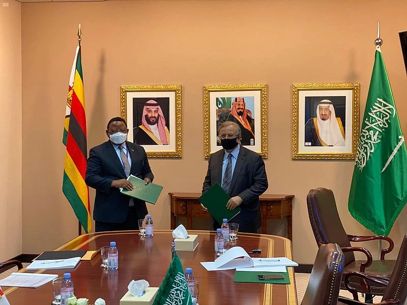 Saudi ambassador to the UN Abdallah Al-Mouallimi and his Zimbabwean counterpart, Frederick Musiiwa Makamure Shava, sign an agreement to establish diplomatic relations between the two countries. (SPA Photo)