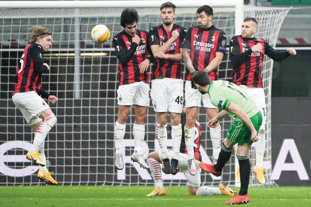 Celtic’s Scottish forward Ryan Christie, front right, shoots a free kick during the UEFA Europa League Group H football match AC Milan vs Celtic in Milan. (AFP)