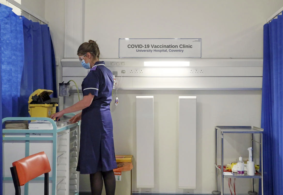 A nurse prepares a cubicle, as medical staff train to administer the COVID-19 vaccine in the COVID-19 Vaccination Clinic at the University Hospital in Coventry, England, Friday, Dec. 4, 2020. (AP)