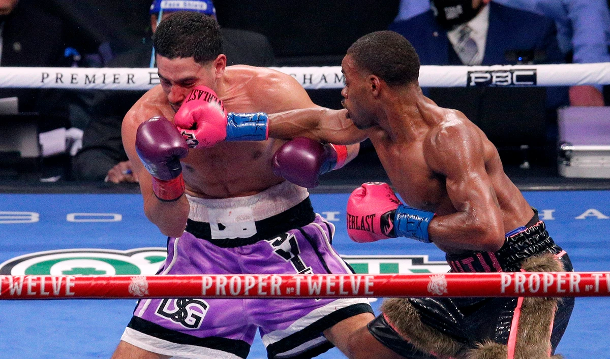 Spence beats Garcia, keeps titles in 1st fight since crash