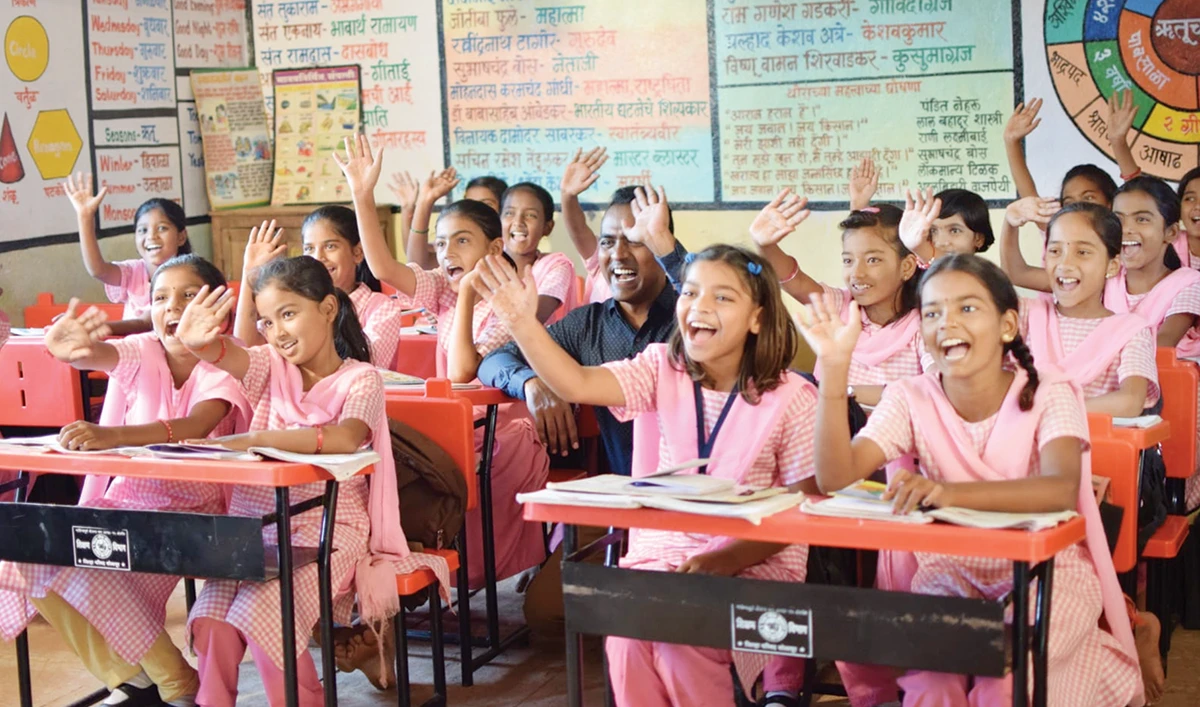 Global Teacher Prize 2020 winner Ranjitsingh Disale with his students at a primary school in Paritewadi village, Solapur district, Maharashtra, India. (Supplied)