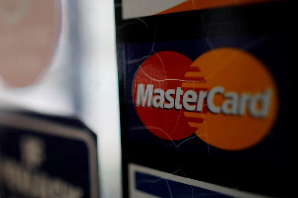 A sticker shows that a store accepts MasterCard in Harvard Square in Cambridge, Massachusetts. (REUTERS/Brian Snyder/File Photo)