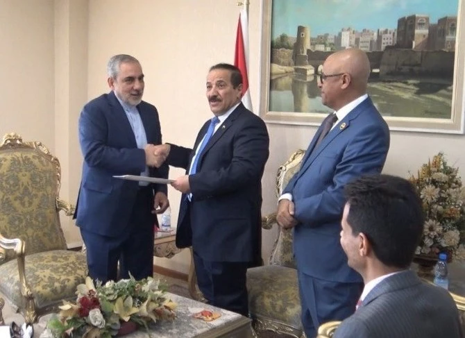 Iran's representative, Hasan Irlu, (left) with the Houthis' self proclaimed foreign minister Hesham Sharaf Abdallah in Sanaa in October. (Handout)