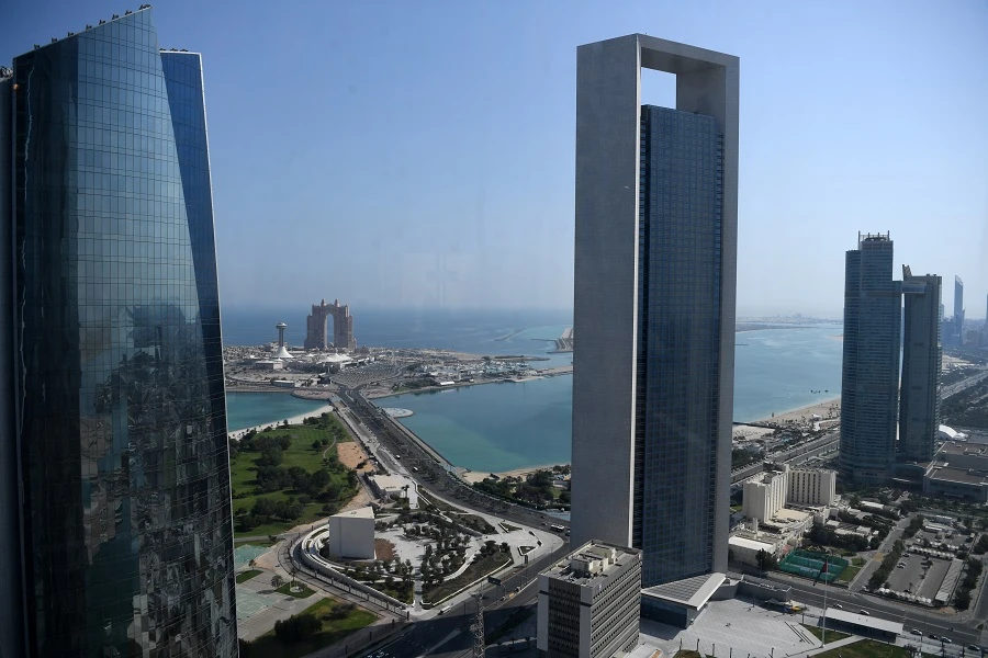 A genral view taken on May 29, 2019 shows the sea front promenade in the Emirati capital Abu Dhabi with the ADNOC headquarters (Abu Dhabi National Oil Company) office complex (C) in the foreground on May 29, 2019. (File/AFP)