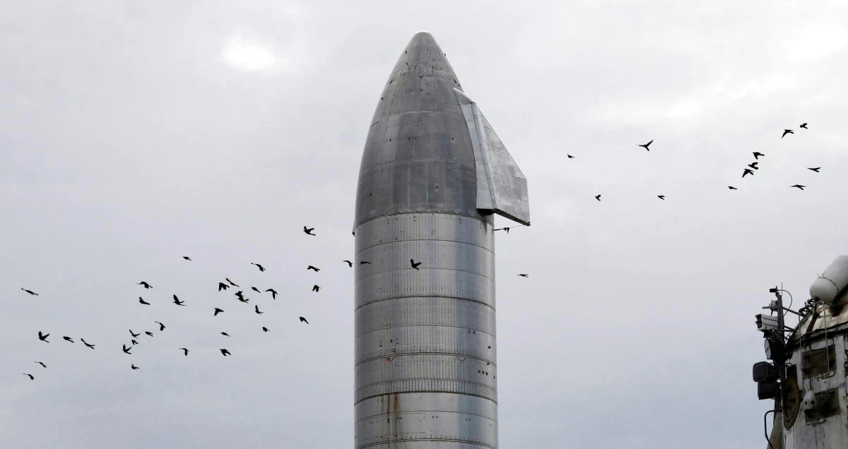 A flock of birds pass over Starship SN8 of SpaceX, days before a test launch of the company’s new super heavy-lift Starship rocket from their facilities in this small town of Boca Chica, Texas, Dec. 4, 2020. (Reuters)