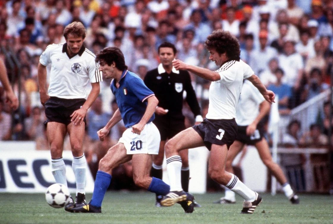 Paolo Rossi is tackled by West Germany’s Paul Breitner in the 1982 World Cup final. (Getty Images)