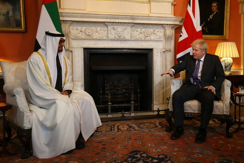 Britain's Prime Minister Boris Johnson (R) talks with greets Abu Dhabi's Crown Prince Sheikh Mohammed bin Zayed al-Nahyan inside 10 Downing Street in central London on December 10, 2020. (File/AFP)