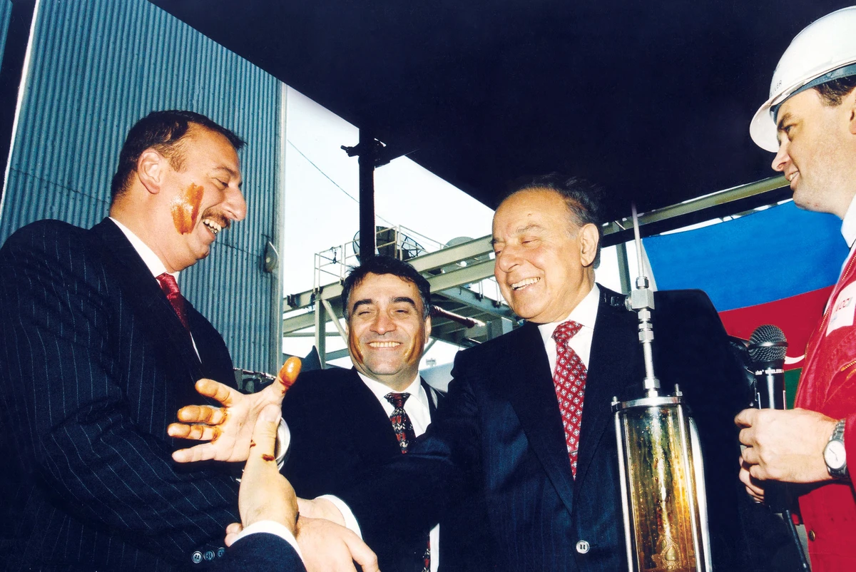 President of Azerbaijan Heydar Aliyev, right, and his successor and son Ilham Aliyev, left, celebrate the tapping of the Azeri-Chirag-Guneshli oil field in the Caspian Sea, November 12, 1997.