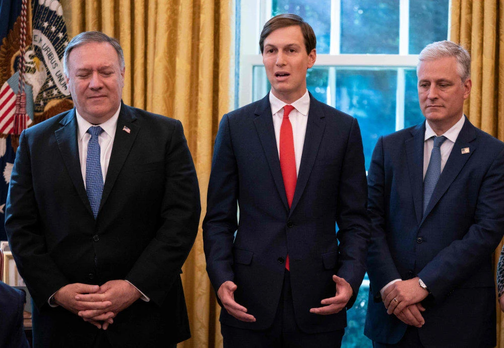 In this file photo taken on October 23, 2020, senior adviser to the president Jared Kushner (C), with Secretary of State Mike Pompeo (L) and National Security Advisor Robert O'Brien, talks about Sudan decision to normalize relations with Israel. (AFP / ALEX EDELMAN)