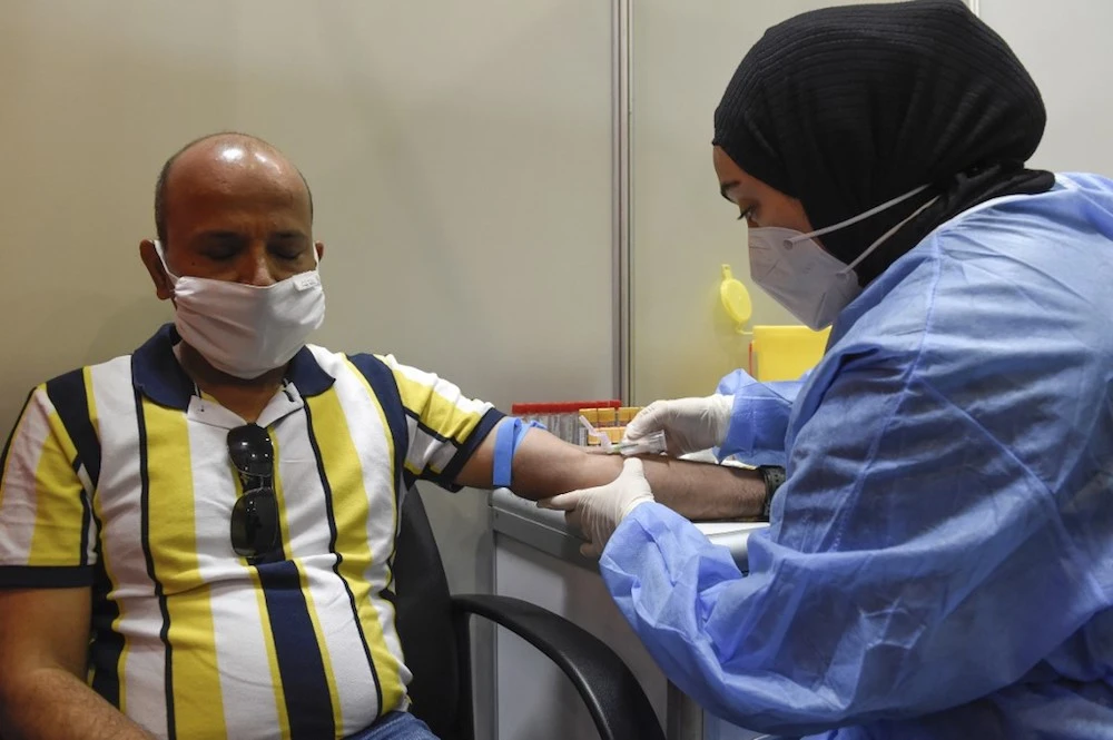 A large-scale trial of the Sinopharm’s COVID-19 vaccine took place in Manama earlier this year. (AFP/File)