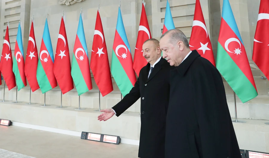 Turkey’s President Recep Tayyip Erdogan, right, is welcomed by Azerbaijan’s President Ilham Aliyev in Baku, Azerbaijan. (AP)