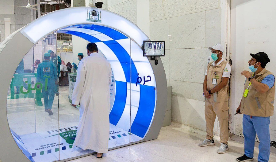 People are seen through a thermal camera as a man enters a new self-sterilization gate at the Grand Mosque, as a preventive measure against the coronavirus disease (COVID-19), in the holy city of Makkah, Saudi Arabia, in this file photo taken on May 7, 2020. (REUTERS)