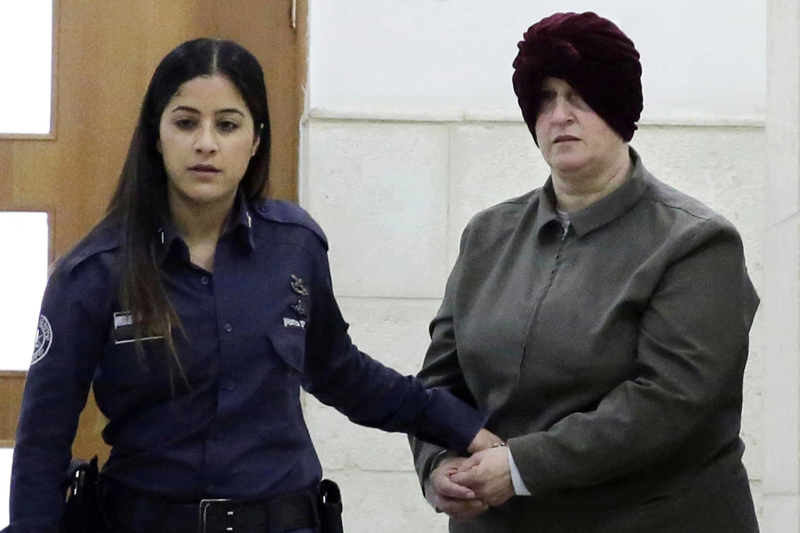 Above, Israeli-born Australian Malka Leifer, right, is brought to a courtroom in Jerusalem. Leifer faces 74 counts of child sex abuse against girls in Australia. (AP)