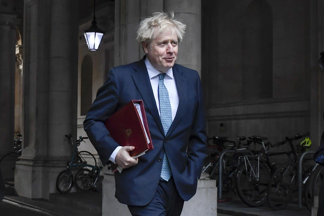 Boris Johnson returns to Downing Street after attending the government’s weekly Cabinet meeting at the Foreign and Commonwealth Office, in London, Tuesday, Dec. 15, 2020. (AP Photo)