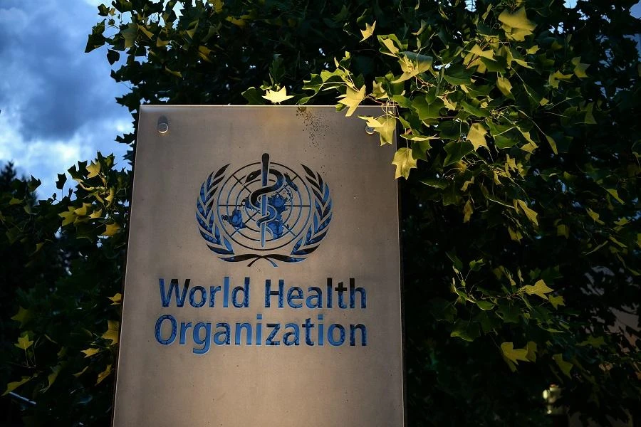 A photo taken in the late hours of August 17, 2020 shows a sign of the World Health Organization (WHO) at their headquarters in Geneva amid the COVID-19 outbreak, caused by the novel coronavirus. (File/AFP)