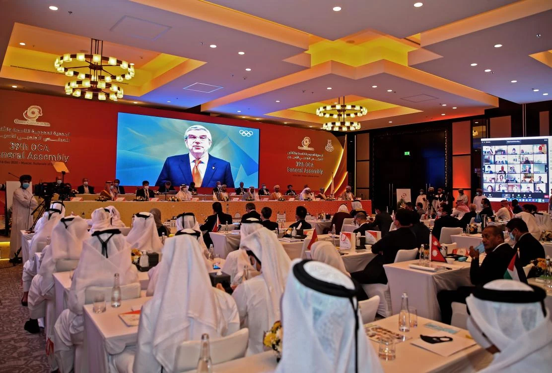 International Olympic Committee President Thomas Bach delivers a speech on video during the 39th Olympic Council of Asia meeting in Muscat, Oman on Dec. 16, 2020. (AFP)