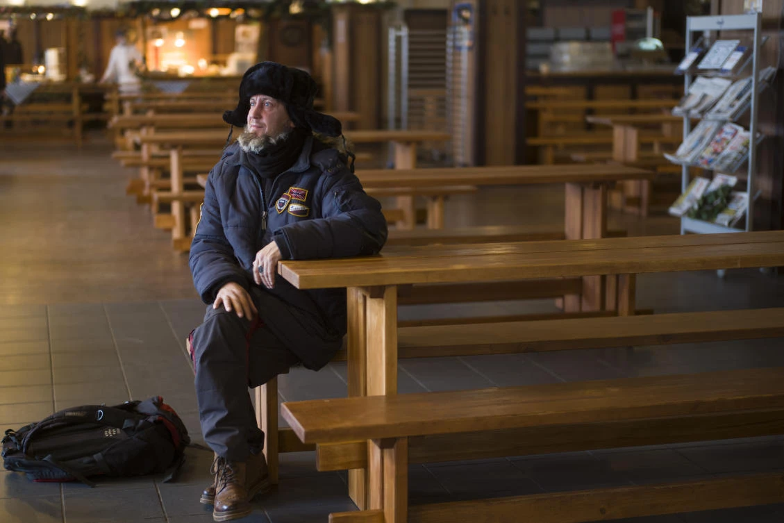 Homeless man Kaspars Breidaks from Latvia poses for a portrait during an interview with the Associated Press in guest room of Berlin's biggest restaurant Hofbraeu Berlin, in Berlin, Germany, Thursday, Dec. 17, 2020. (AP)