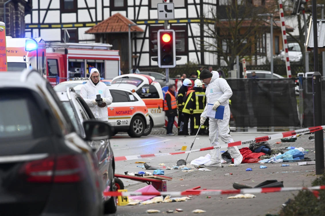 FILE - In this Monday, Feb. 24, 2020 file photo, police and rescue workers stand next to the scene of an incident with a car that is said to have crashed into a carnival parade in Volkmarsen, central Germany. (AP)