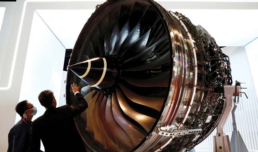 Men check Rolls Royce’s Trent Engine displayed in Singapore. (Reuters/File)