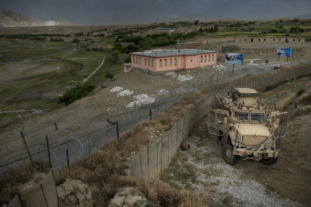 Members of the Czech Army use an armed vehicle to provide security while they rest at an Afghanistan National Army base between patrols near Bagram Airfield in Parwan on May 29, 2014. (File/AFP)