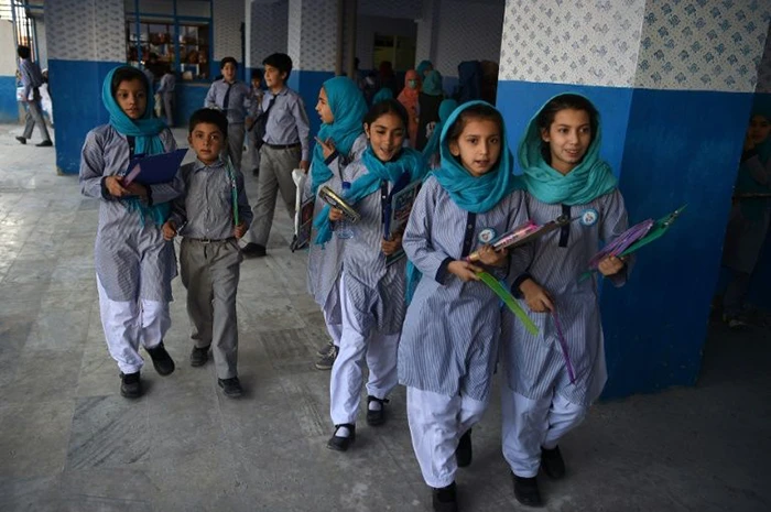 In this photo taken on July 16, 2019, Afghan schoolgirls leave after the mid-term exams at a school in Kabul. (AFP)