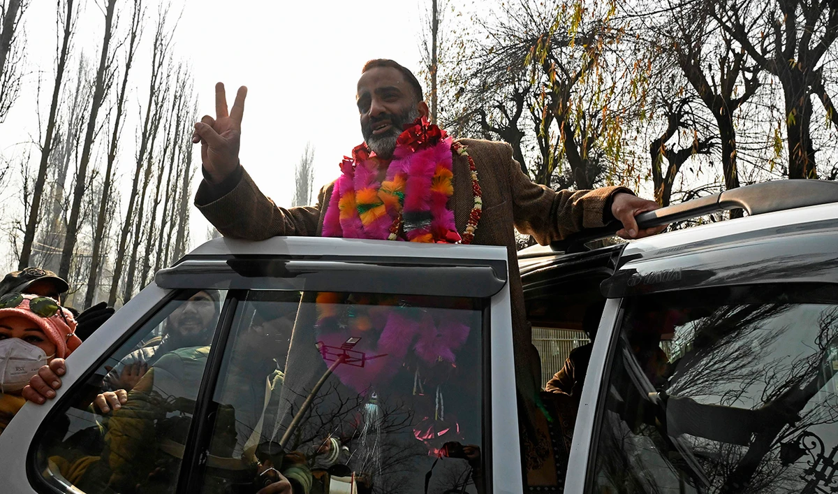 Salman Sagar, National Conference candidate for the state Urban Local Bodies (ULB) polls celebrates after he won a ULB seat outside a counting center in Srinagar on December 22, 2020. (AFP)