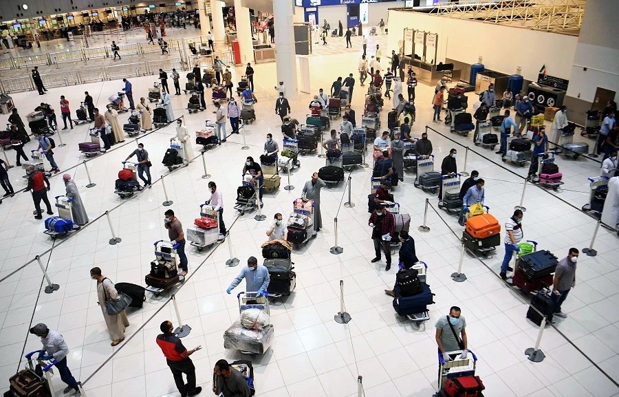 Egyptian citizens queue at Kuwait International Airport before boarding a repatriation flight to Cairo, in Kuwait City on May 5, 2020. (File/AFP)