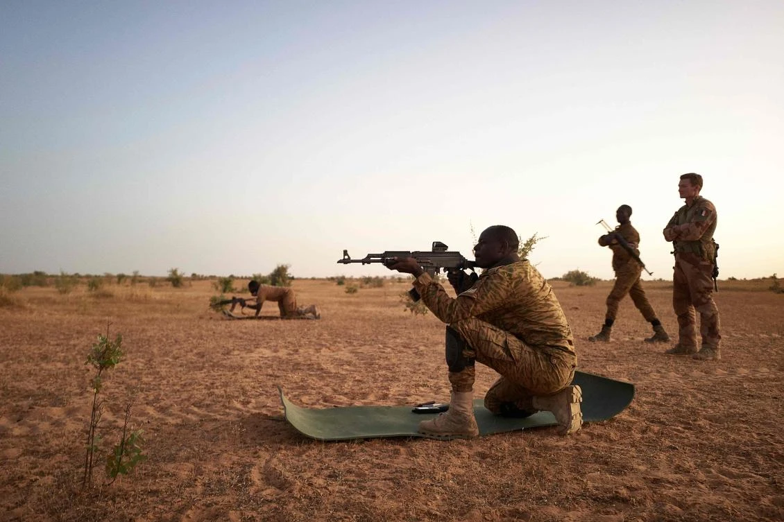 In this file photo taken on November 12, 2019 soldiers of the Burkina Faso Army take part in shooting exercises during a joint operation with the French Army in the Soum region in northern Burkina Faso. (AFP)