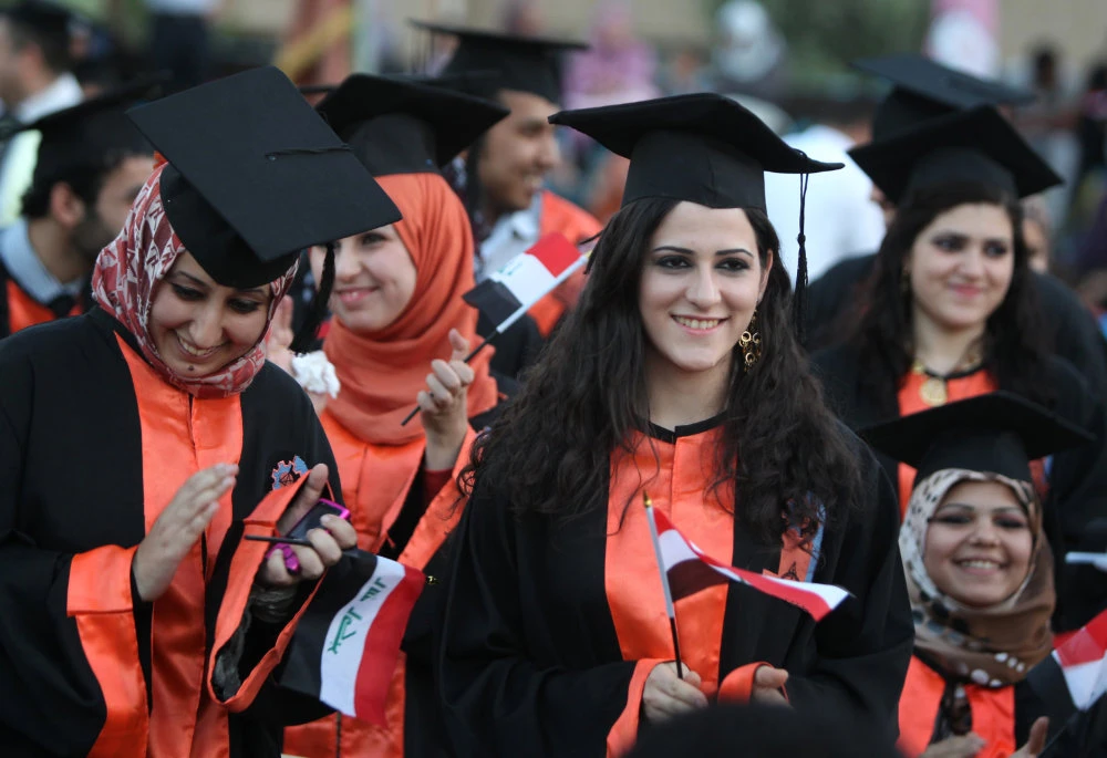 Looking to the future: Iraqi students celebrate their graduation at the Technical University of Baghdad. (AFP)