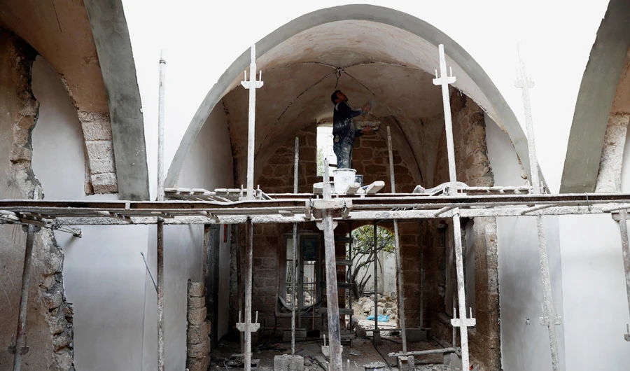 A worker renovates the long-abandoned 200-year-old Ghussein palace, in the old quarter of Gaza City, Monday, Dec. 14, 2020. (AP)