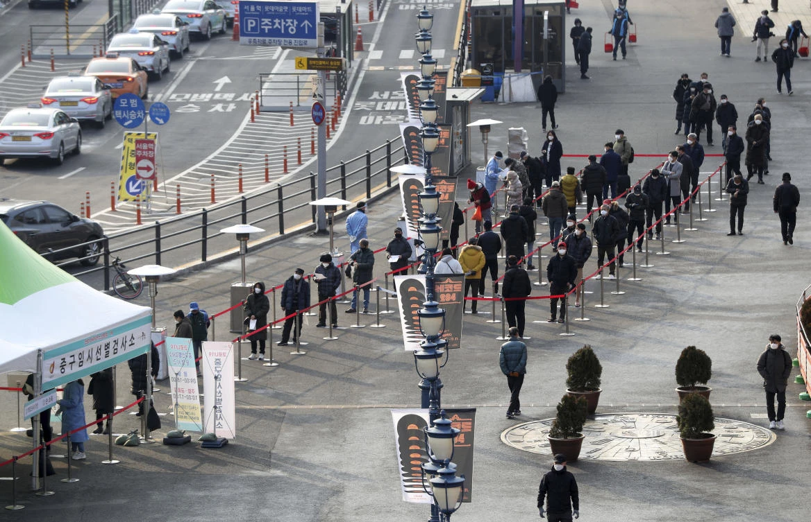 South Korea had largely managed to control early major outbreaks with aggressive testing and contact tracing. Above, residents queue to have their COVID-19 tests taken in Seoul. (Newsis via AP)