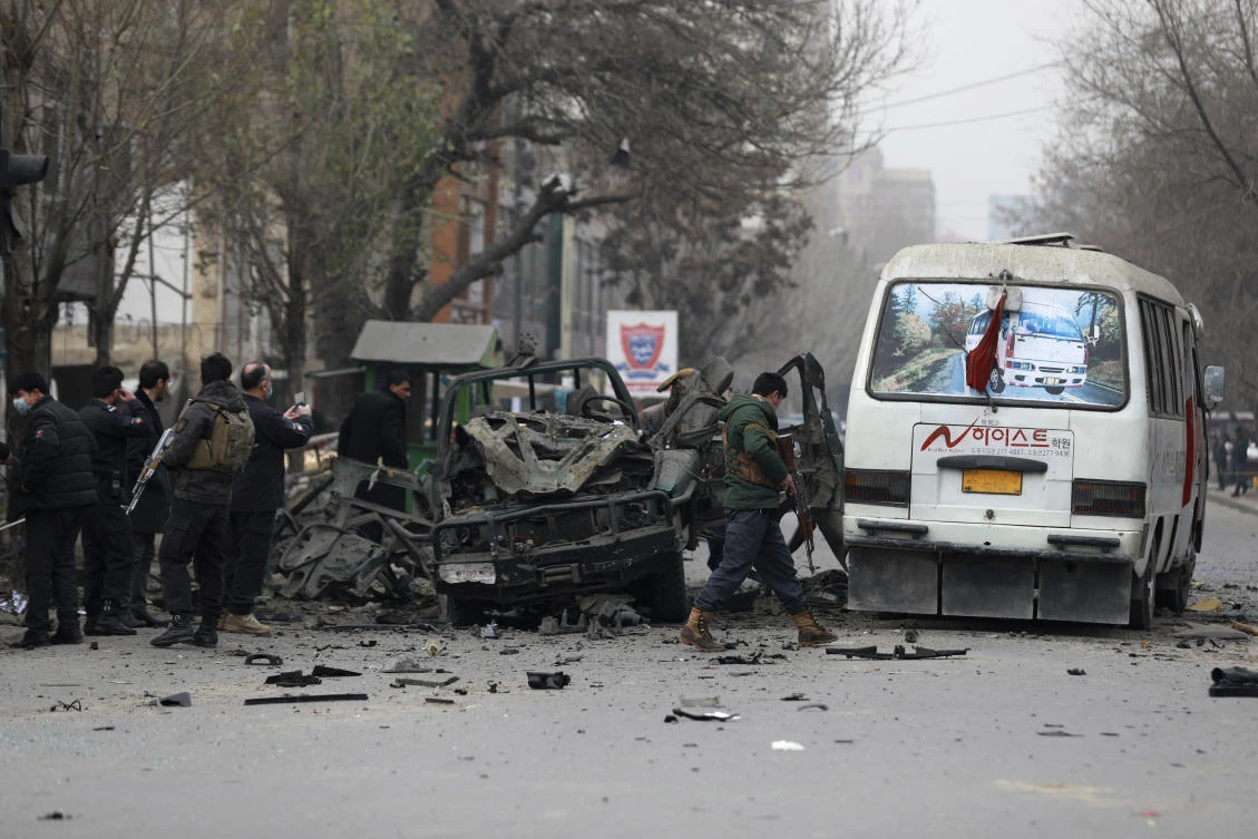 Afghan security personnel inspect the site of a bomb attack in Kabul, Afghanistan, Saturday, Dec. 26, 2020. A series of explosions hit the Afghan capital on Saturday morning. (AP)