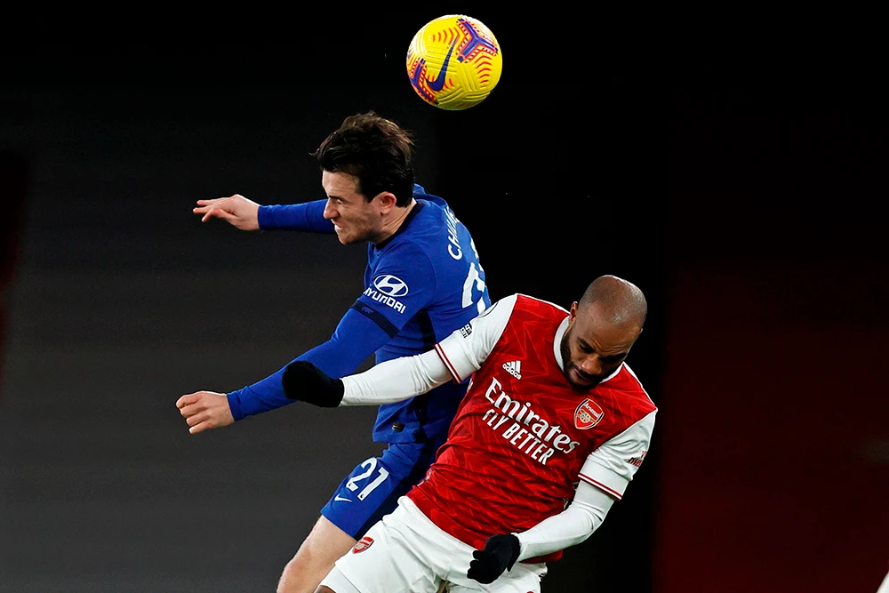 Chelsea’s defender Ben Chilwell vies with Arsenal’s striker Alexandre Lacazette during Saturday’s match. (AFP)