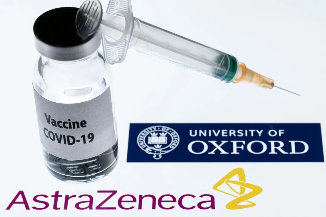This illustration picture taken in Paris shows a syringe and a bottle reading "Covid-19 Vaccine" next to AstraZeneca company and University of Oxford logos. (File/AFP)