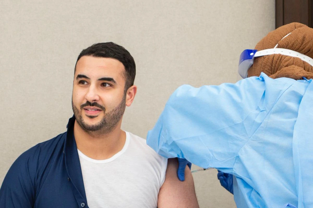 Saudi Arabia's Deputy Defense Minister Prince Khalid bin Salman receives the first shot of a coronavirus vaccine on Sunday. (@kbsalsaud)