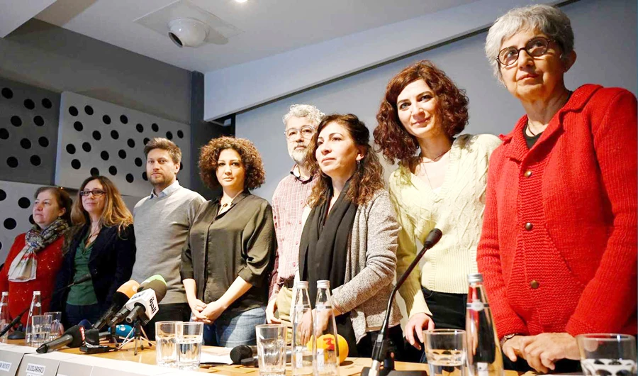 Members of Amnesty International and other NGOs attend a press conference to condemn attacks on civil society groups in Turkey. (AFP/File)