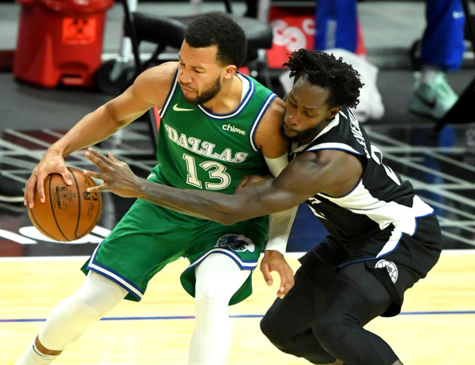 Dallas Mavericks guard Jalen Brunson (13) controls the ball against Los Angeles Clippers guard Patrick Beverley (21) in the first half at Staples Center in Los Angeles. (Jayne Kamin-Oncea-USA TODAY Sports)