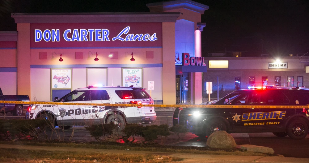 Rockford police and other law enforcement agencies investigate the scene of a shooting at a bowling alley in Rockford, Ill. (Rockford Register Star via AP)