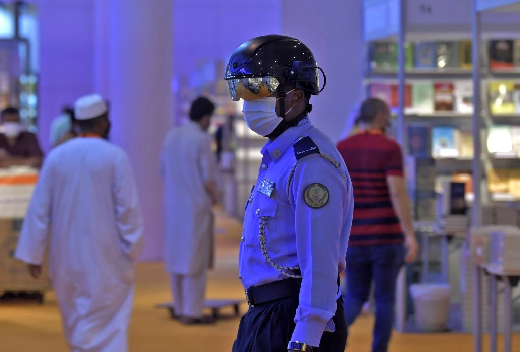 An Emirati policeman uses a smart helmet to detect people’s temperature to fight the spread of the Covid-19 on Nov. 4, 2020.