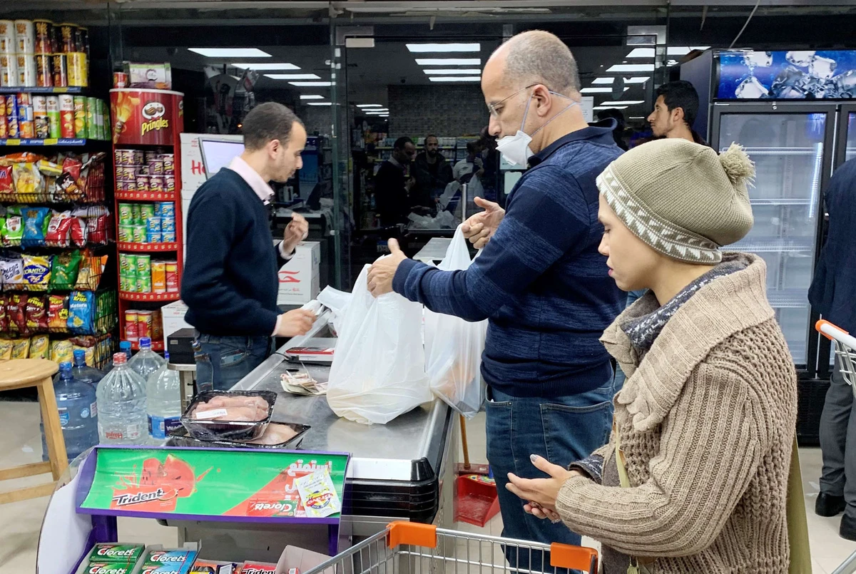A man wearing a protective face mask shops at Exception Market before the start of night-time curfew to contain the spread of the coronavirus disease (COVID-19 in Cairo, Egypt March 26. (REUTERS)