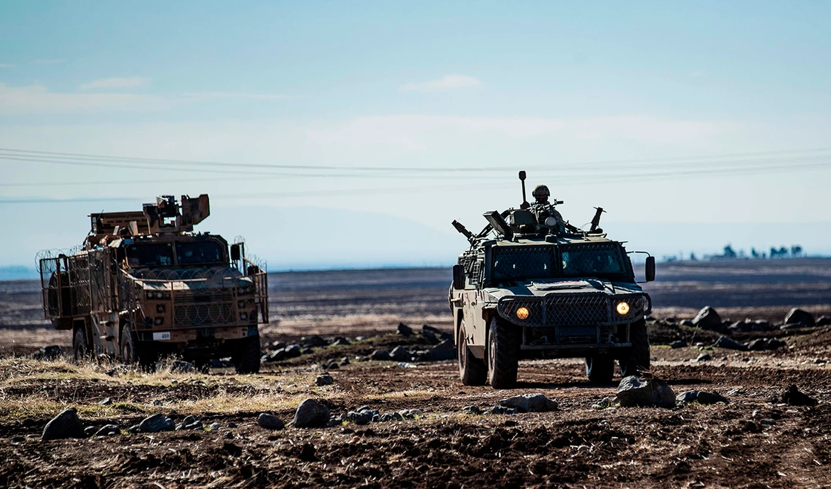 A joint Russian-Turkish patrol advances in the countryside of the Syrian town of Al-Jawadiyah, in the northeastern Hasakeh province, near the border with Turkey, on December 24, 2020. (AFP)